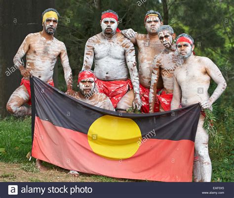 Six Australian Aboriginal Men Painted With White Ochre Pose With Stock