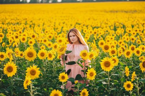 Beautiful Girl In A Huge Yellow Field Of Sunflowers Stock Image Image