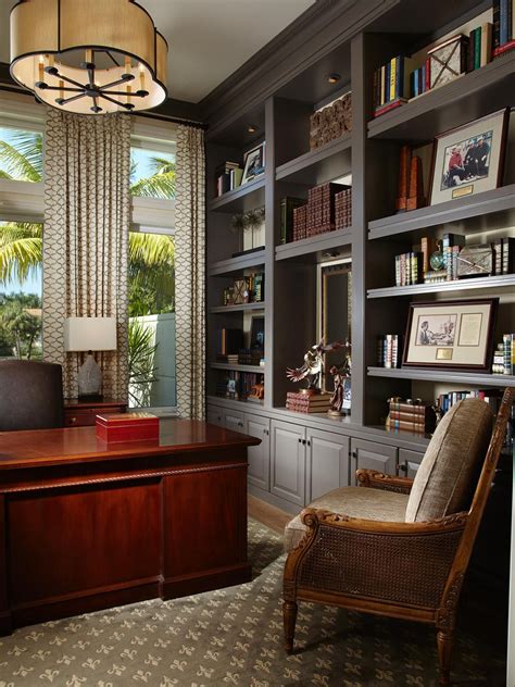 With A Glossy Mahogany Desk And Expansive Gray Built Ins This Home