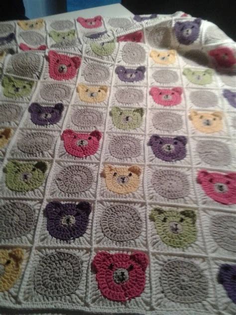 A Crocheted Blanket With Teddy Bears On The Front And Back All In