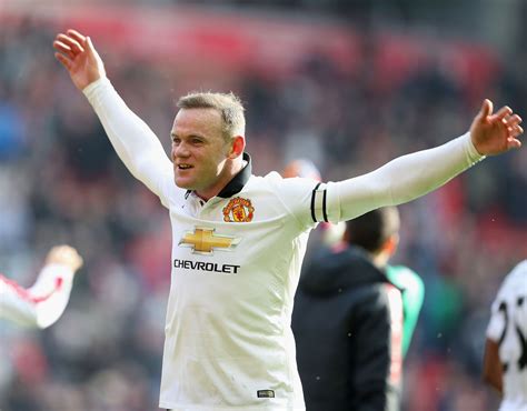 reds skipper wayne rooney embarks on an impassioned celebration with the manutd fans following