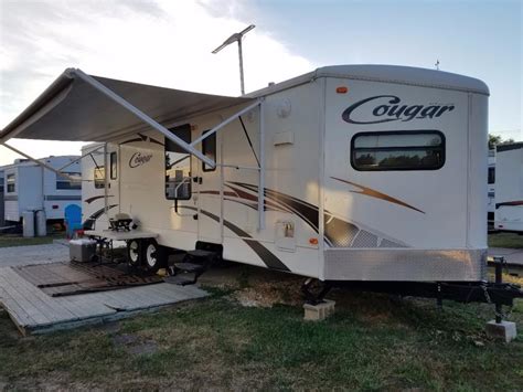 Specs 30 foot cougar sleeping accommodations for up to 6 people built in stereo system interior expansion with one slide out simulated wood vinyl flooring full kitchen facility dinette that converts to a bed bedroom includes. 2010 Keystone Cougar 30fkv rvs for sale