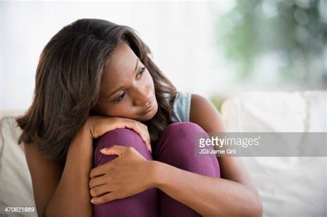 Black Woman Hugging Knees Photos Et Images De Collection Getty Images