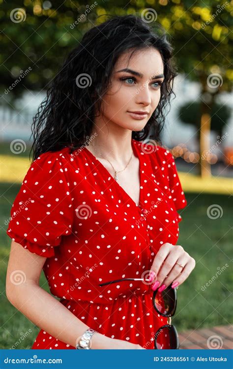 Good Beautiful Italian Girl With A Curly Hairstyle In A Fashionable