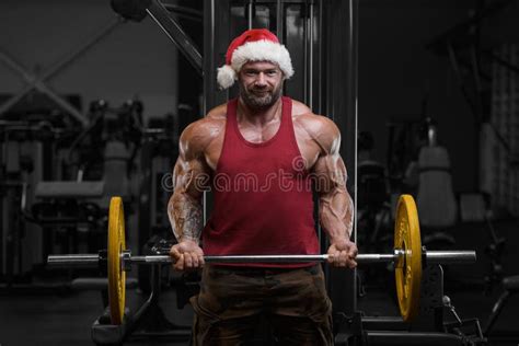 Bodybuilder In Santa Claus Costume In The Gym Stock Image Image Of Dumbbell Athlete