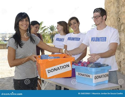 Group Of Volunteers Collecting Clothing Donations Stock Photo Image