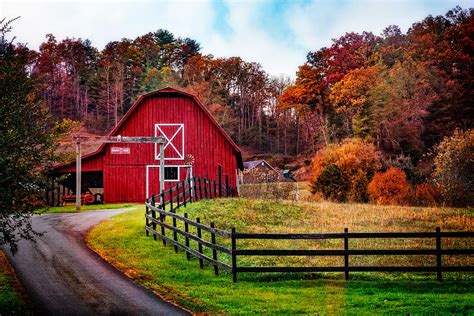 Imagine its history, and the beauty of the ages of use. Autumn Red Barn Photograph by Debra and Dave Vanderlaan