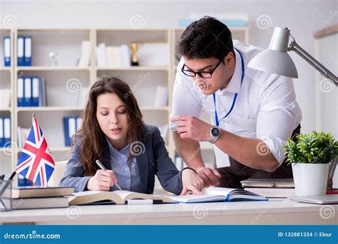 The Teacher Explaining To Student At Language Training Stock Photo