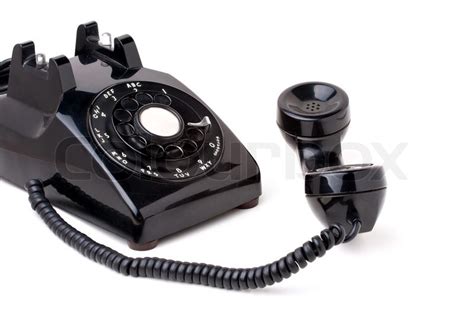 An Old Black Antique Rotary Style Telephone Off The Hook Isolated Over