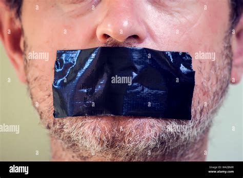 Man With Tape Over Mouth Hi Res Stock Photography And Images Alamy