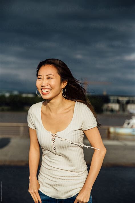 asian woman smiling by stocksy contributor jayme burrows stocksy