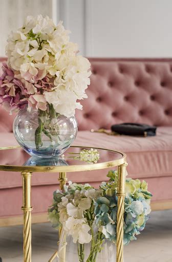 Glorious Pastel Pink Bouquet In Glass Jug On Mirror Table Near The