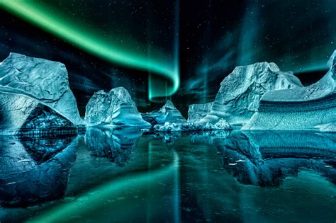 Iceberg Floating In Greenland Fjord At Night With Green Northern Lights