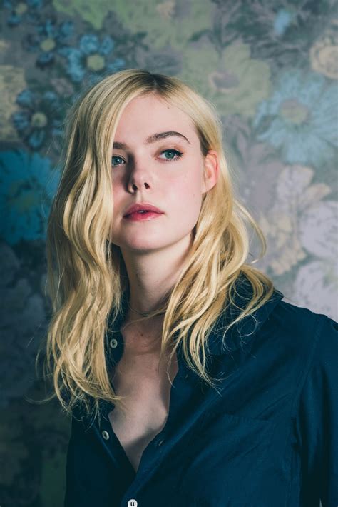 elle fanning strikes a pose at the toronto film festival see more here photo by caitlin