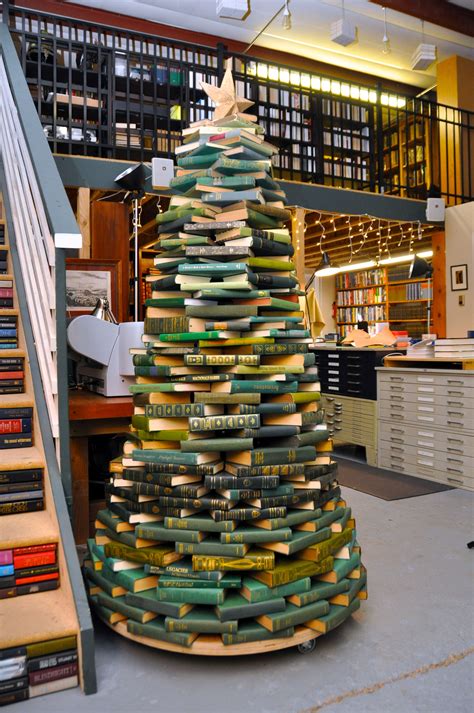 Juniper Books' Christmas Tree made out of green books. | Juniper books, Green books, Christmas tree