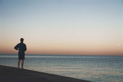 Person Man Standing Near Sea Standing Image Free Photo