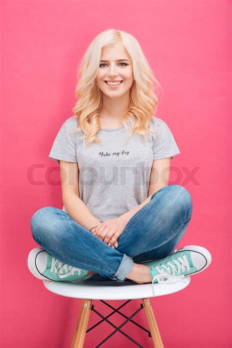 Pretty Blonde Woman Sitting On The Chair Stock Image Colourbox