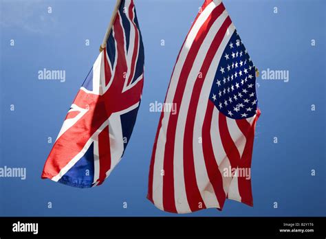 American Flag Hanging With Union Jack British Flag Next To The White