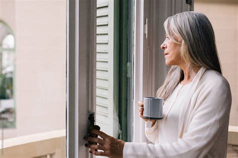 Senior Woman Relaxing At Home By Stocksy Contributor Bonninstudio