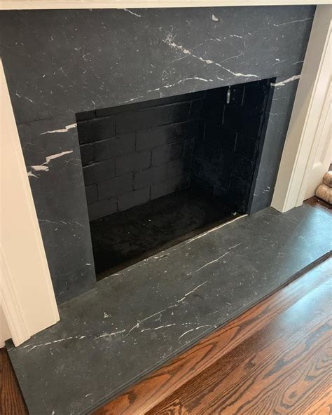 Honed Black Marble Installed For This Fireplace Surroundmakes Me So