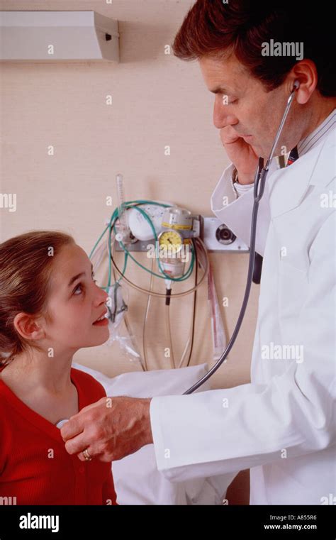 Hospital Paediatrician Doctor Examining Young Girl Child Patients