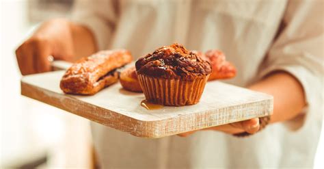 Person Serving Muffin On Wooden Tray · Free Stock Photo