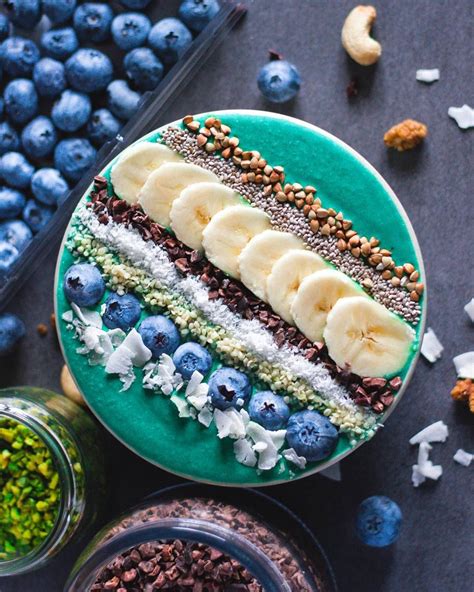 Spirulina Smoothie Bowl Topped With Coconut Blueberries Hemp Seeds