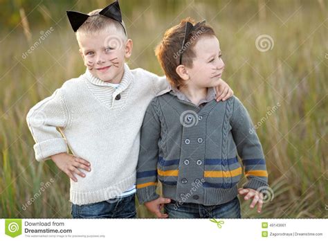 Portrait Of Two Boys In The Summer Stock Image Image Of Kitten