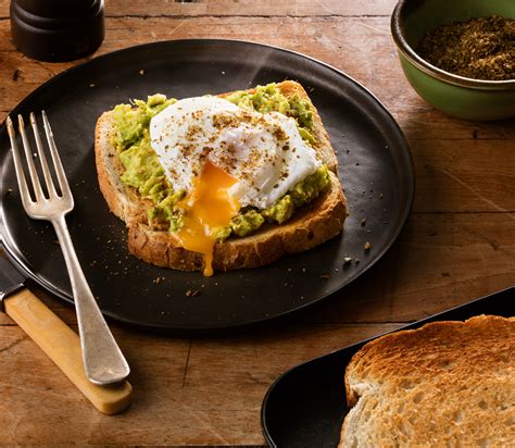 Smashed Avocado Poached Eggs And Dukkah On Toast Ploughmans Bakery