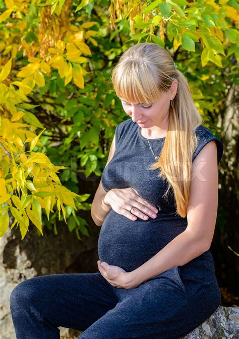 Heavily Pregnant Woman With A Lovely Smile Stock Image Colourbox