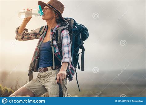 Portrait Of A Female Hiker Drinking Water Stock Image Image Of Active Hill 141496125