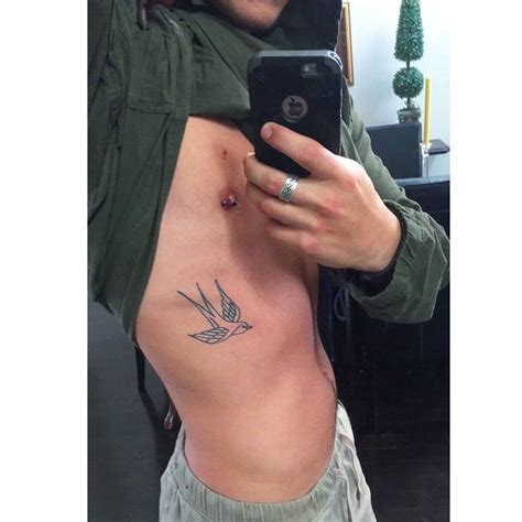 Boys like to have inspirational quotes as tattoos, one that is even challenging death. Swallow men's rib tattoo | Rib tattoo, Small rib tattoos
