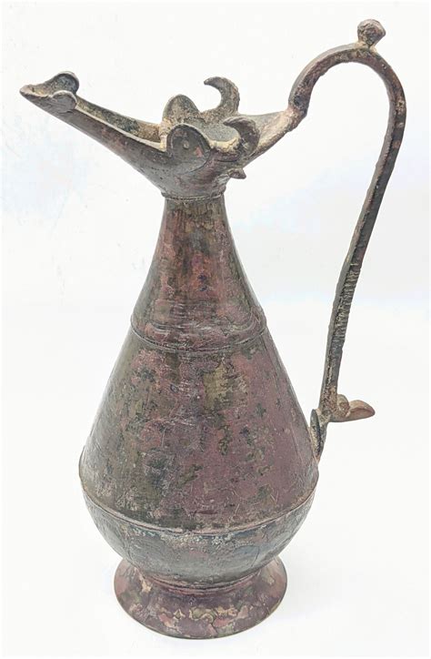 a rare 12 13th century persian seljuk bronze jug with bu…