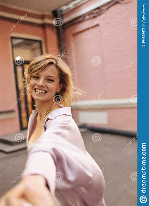 Close Up Of Happy Caucasian Young Blonde Woman Laughs And Stretches