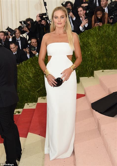 Margot Robbie Dons Simple White Strapless Dress As She Steps Out At The