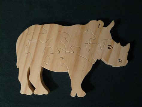 Rhinoceros Wooden Puzzle Pinned By Wooden Puzzles