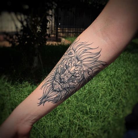 tribal-lion-hand-tattoo-upper-arm-tattoos,-arm-tattoos,-arm-tattoos-for-women