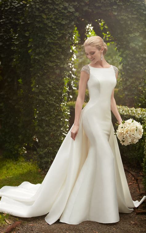 The train of your wedding dress is a gorgeous, dramatic, and, by nature of having a long swathe of fabric trailing behind you, somewhat cumbersome detail. Bridal Gowns | Wedding Dress with Detachable Train ...
