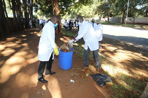 in pics clean up campaign across zimbabwe three men on a boat