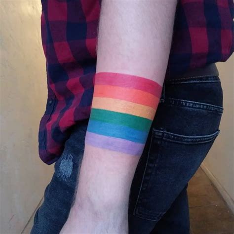 23 rainbow tattoo design examples for pride month and beyond rainbow tattoos rainbow tattoos