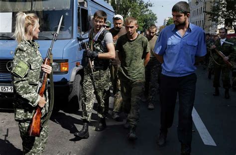 rebels parade captured ukrainian soldiers in east