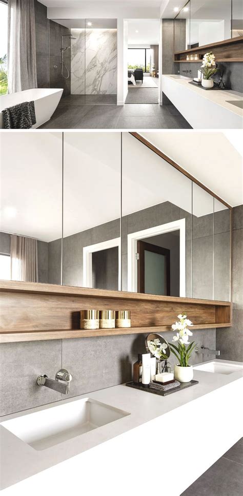 As ensuite bathrooms are quite common in many modern homes, but the ensuite bathrooms are not designed carefully then the decoration will lead to draining away of the chi. This modern ensuite bathroom features a large walk-in shower, a long white vanity with undermoun ...