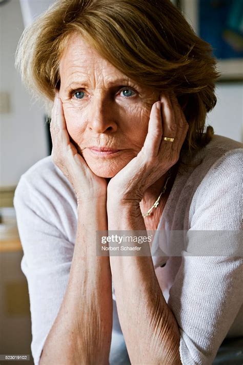 Woman With Head In Hands High Res Stock Photo Getty Images