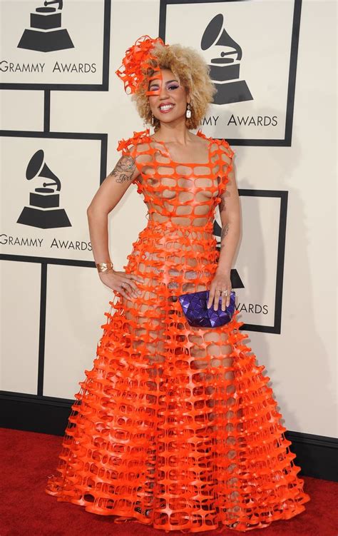 Lady In An Orange Dress At The 2011 Grammy Awards With Her Hair Pulled