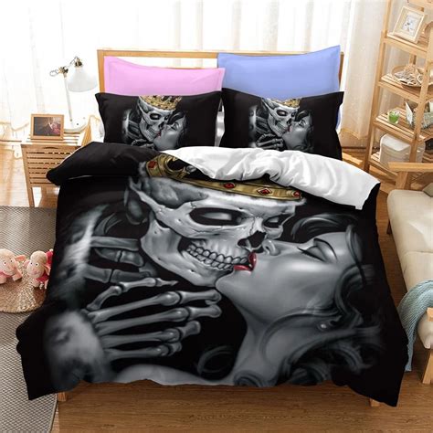 a bed room with a skull comforter and pillows