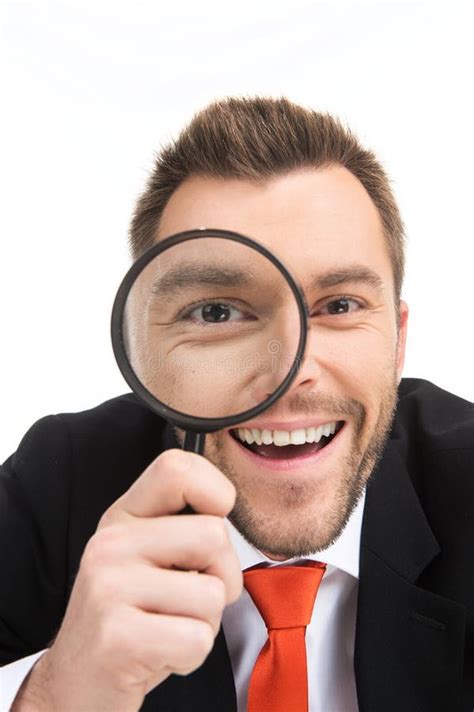 happy man looking through magnifying glass stock image image of handsome magnifying 44057335