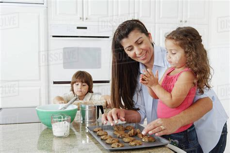 Mother And Children Baking Cookies Stock Photo Dissolve