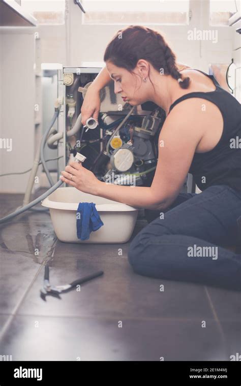 Woman Needs A Plumber To Repair The Leak Stock Photo Alamy