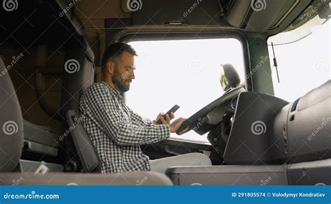 Professional Trucker Phoning While Sitting In His Truck Stock Footage