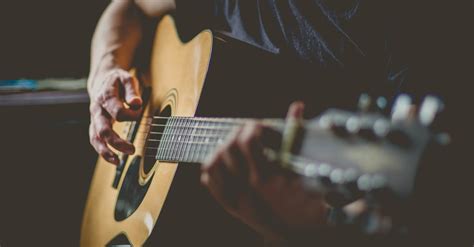 Man Playing An Acoustic Guitar · Free Stock Photo